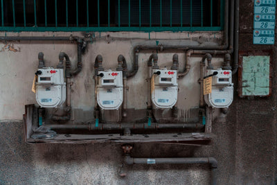 Digital flow meter with electronic transmitter and readout on industrial pipe