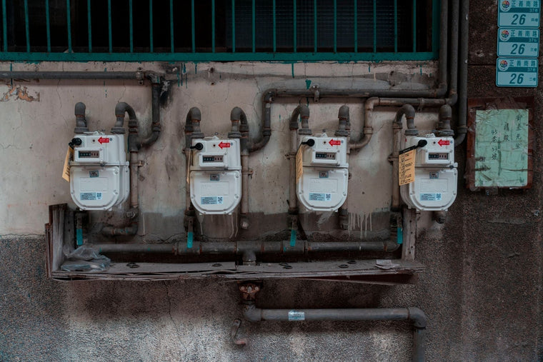 Digital flow meter with electronic transmitter and readout on industrial pipe