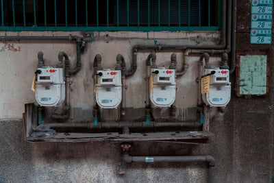 Digital flow meter with electronic transmitter and readout on industrial pipe